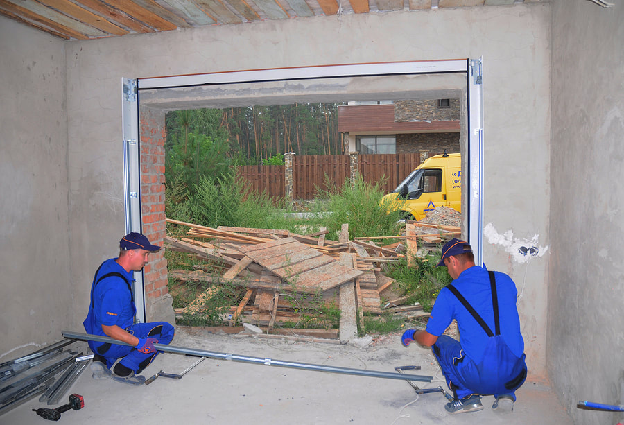 handyman doing garage door replacement